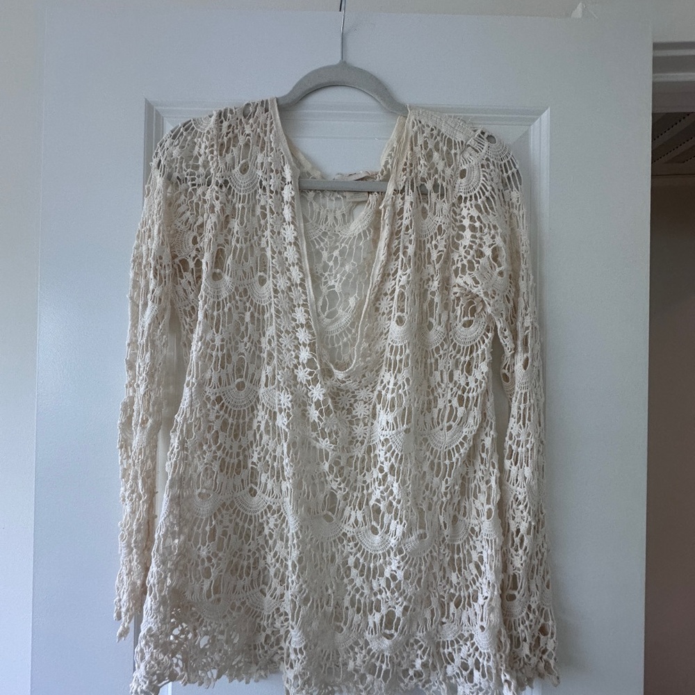 Cream crochet blouse with a boho vibe